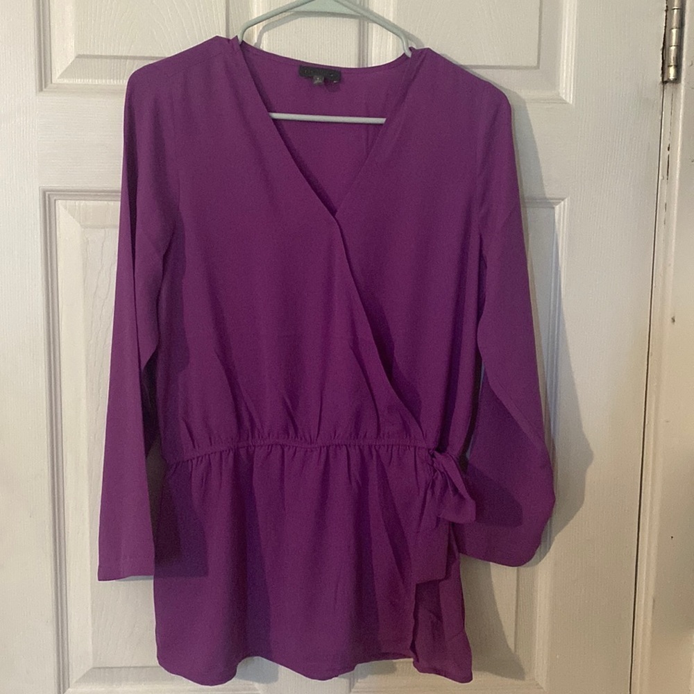 The limited quarter sleeve wrap blouse